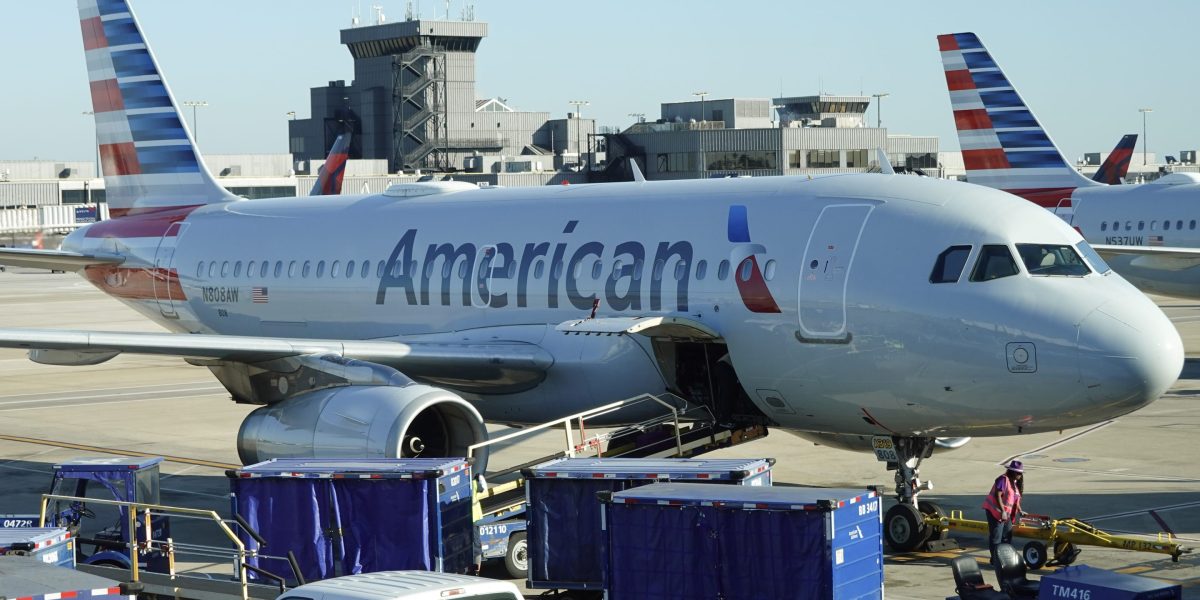 American Airlines plane catches fire at Denver airport, sending 12 people to the hospital