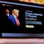 The World Liberty Financial website, including a photo of Donald Trump, displayed on a laptop