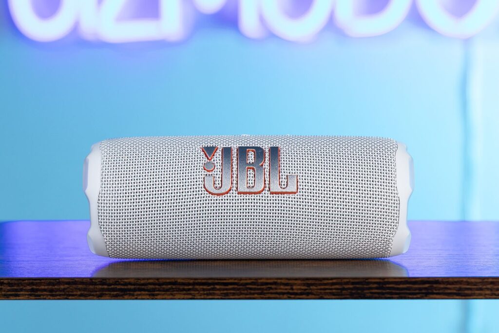 JBL Flip 7 with neon Gizmodo sign