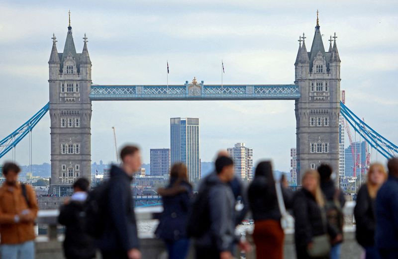 UK employers slow hiring, pay growth cools, survey shows