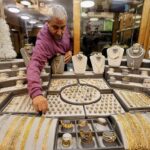 Gold hovers near record high on safe-haven demand; Fed decision in focus