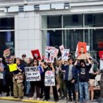 Anti-Musk protesters gather outside Tesla dealership in Washington