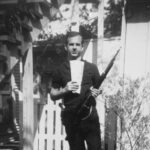 Assassination of John F. Kennedy Add topic 4 ⁄ 33 More details  Photo of Lee Harvey Oswald with rifle, taken in Oswald's back yard, Neely Street, Dallas Texas, March 1963. The photo was Warren Commission exhibit 133-A.