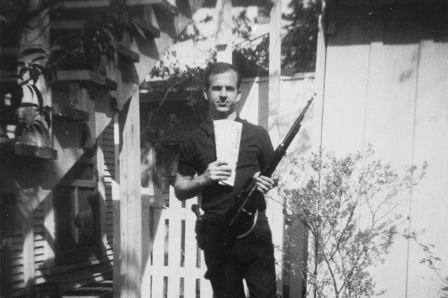 Assassination of John F. Kennedy Add topic 4 ⁄ 33 More details  Photo of Lee Harvey Oswald with rifle, taken in Oswald's back yard, Neely Street, Dallas Texas, March 1963. The photo was Warren Commission exhibit 133-A.