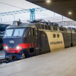 A train with the logo of the Ukrzaliznytsia arrives at the railway station on February 24, 2025 in Kyiv, Ukraine.