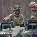 Prince William rides in tank during Estonia visit