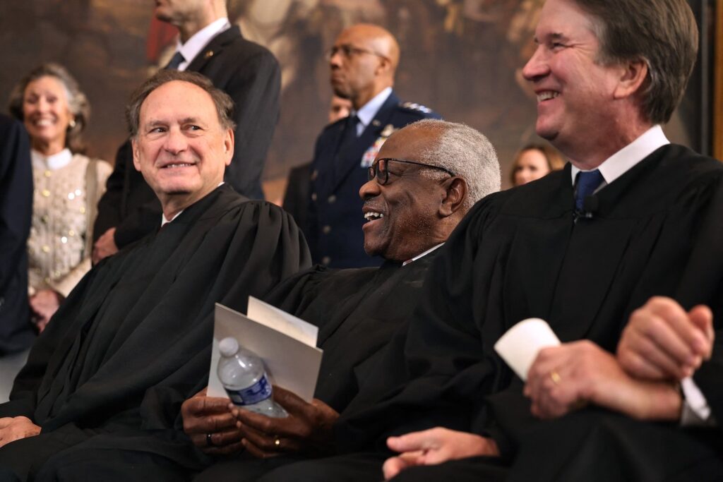 U.S. Supreme Court Associate Justices Samuel Alito, Clarence Thomas and Brett Kavanaugh laugh at the conclusion of the inauguration ceremonies in the Rotunda of the US Capitol on January 20, 2025 in Washington, DC.