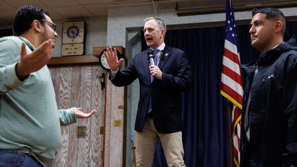 Protesters disrupt, jump on stage during Democrat congressman's town hall