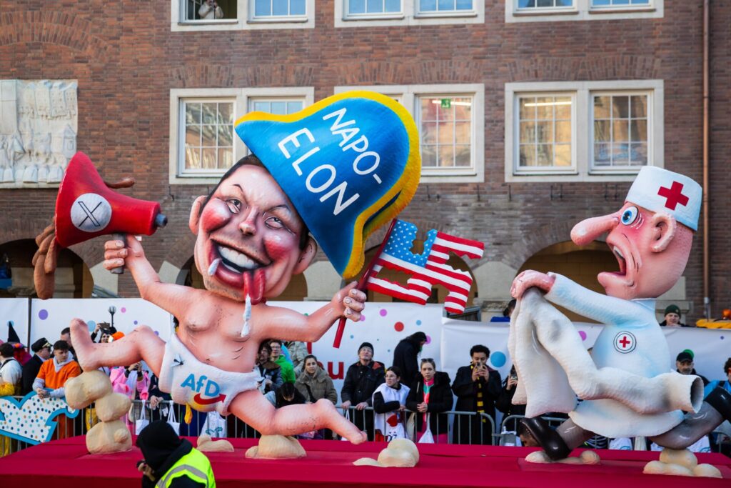 A carnival float mocks Elon Musk the German party AfD and the US during the annual Rose Monday parade during carnival on March 03, 2025 in Dusseldorf, Germany