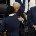 Trump shakes hands with NCAA wrestling champions after title bout