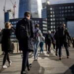 City office workers crossing London Bridge