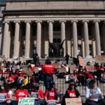 Students stage a walk-out protest at Columbia University’s Low Library steps