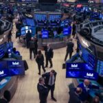 Traders work on the floor of the New York Stock Exchange