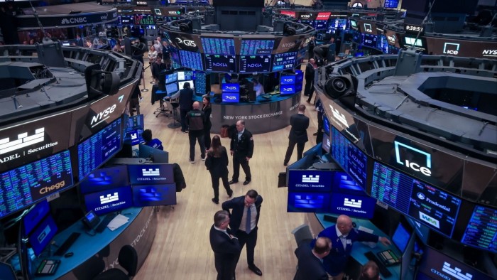 Traders work on the floor of the New York Stock Exchange