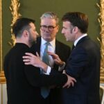 Volodymyr Zelenskyy, Keir Starmer, and Emmanuel Macron are engaged in a discussion