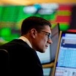 Traders work on the options floor at the New York Stock Exchange