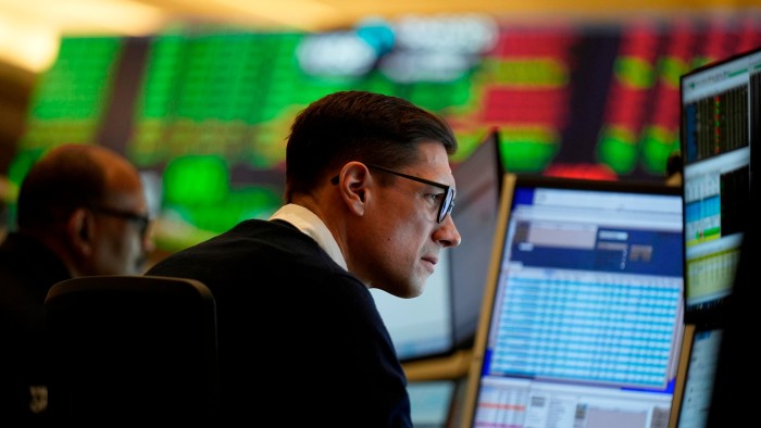 Traders work on the options floor at the New York Stock Exchange