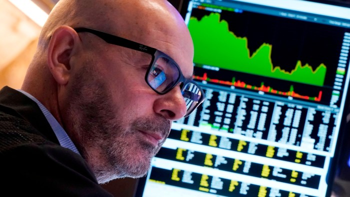 A trader works on the floor of the New York Stock Exchange