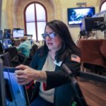 Traders on floor of New York Stock Exchange