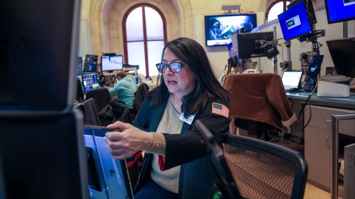 Traders on floor of New York Stock Exchange