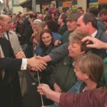 President Bill Clinton meets with residents during a walk through Belfast