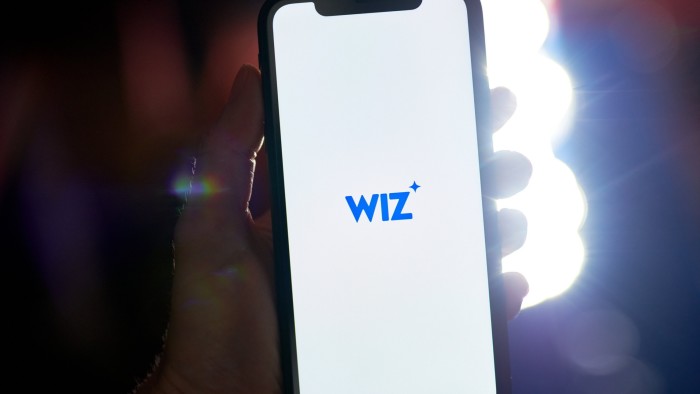 The Wiz logo on a smartphone