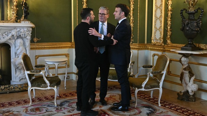 Volodymyr Zelenskyy, Keir Starmer, and Emmanuel Macron stand together in conversation