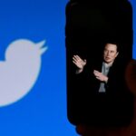 A phone screen displays a photo of Elon Musk with the Twitter logo shown in the background