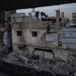 Palestinians among the rubble of destroyed buildings during the holy month of Ramadan in Jabalia refugee camp, northern Gaza Strip