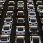 Tesla vehicles in a parking lot after arriving at a port in Yokohama, Japan