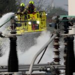 Firefighters extinguish the fire at the North Hyde electrical substation