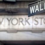 A Wall Street sign is pictured outside the New York Stock Exchange