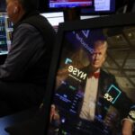 Traders work on the floor of the New York Stock Exchange