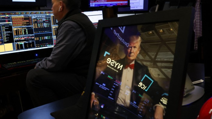 Traders work on the floor of the New York Stock Exchange