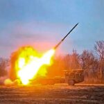 A Russian rocket launcher fires at Ukrainian positions