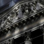 Morning sunlight falls on the facade of the New York Stock Exchange