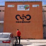 The NSO Group company logo is displayed on a wall of a building next to one of their branches in the southern Israeli Arava valley near Sapir community centre on February 8, 2022. - Israel's domestic spying scandal widened yesterday, with Prime Minister Naftali Bennett vowing government action following new reports that police illegally used the Pegasus malware to hack phones of dozens of prominent figures. (Photo by MENAHEM KAHANA / AFP) (Photo by MENAHEM KAHANA/AFP via Getty Images)