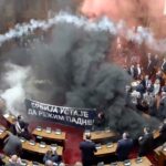 Serbian opposition lawmakers throw smoke grenades, tear gas in parliament