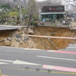 Motorcyclist who disappeared into sinkhole is found dead following search